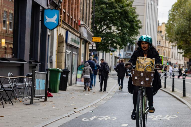 Woman cycling in Bristol