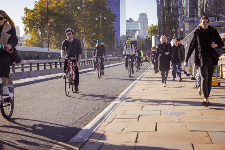 People walking and cycling in Blackfriars, London.