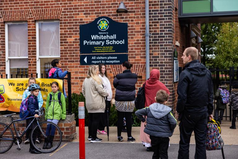 Children and parents outside Whitehall Primary School, Bristol.