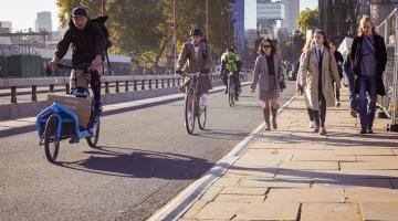 People walking and cycling in Blackfriars, London.