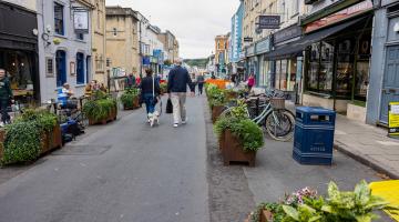 People walking on road in a low traffic neighbourhood in Cotham Hill, Bristol.