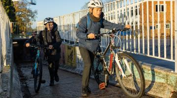 Two teen boys leaving a tunnel on cycles in Kesgrave.