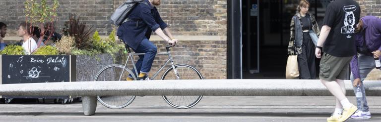 Person cycling in Granary Square.