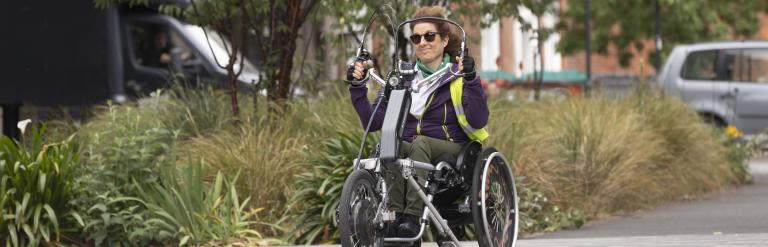 Woman using a handcycle in Vauxhall, London.